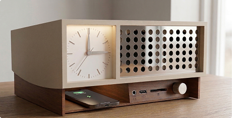 KINO Multimodal Speaker Unit with phone on top wireless charging